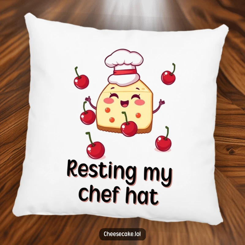 Funny pillow showing a cheesecake slice in a chef hat juggling cherries, providing comfort and a splash of kitchen humor.
