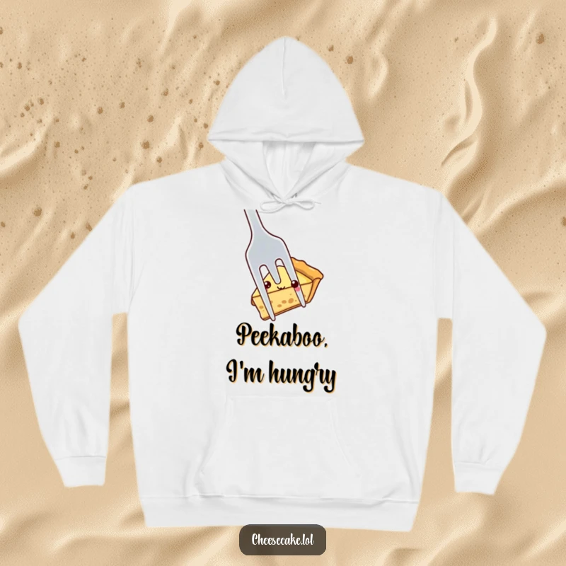 Funny shy pie slice peeking out from behind a large fork, a cozy and humorous design on a warm hoodie for comfort.