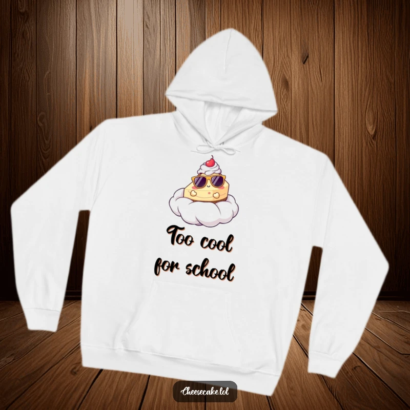 Funny hoodie showcasing a cheesecake in sunglasses lounging on a fluffy whipped cream cloud, offering warmth and humor.