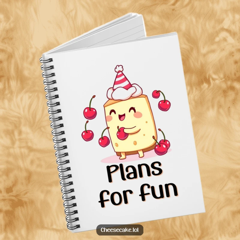 Funny cheesecake juggler notebook cover featuring a cheesecake character in a party hat, juggling cherries happily.